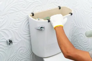 Workerman Performs Repair Of Toilet Bowl, To Repair The Pipe From The Toilet